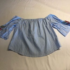 off the shoulder. flared, mid-length sleeve top